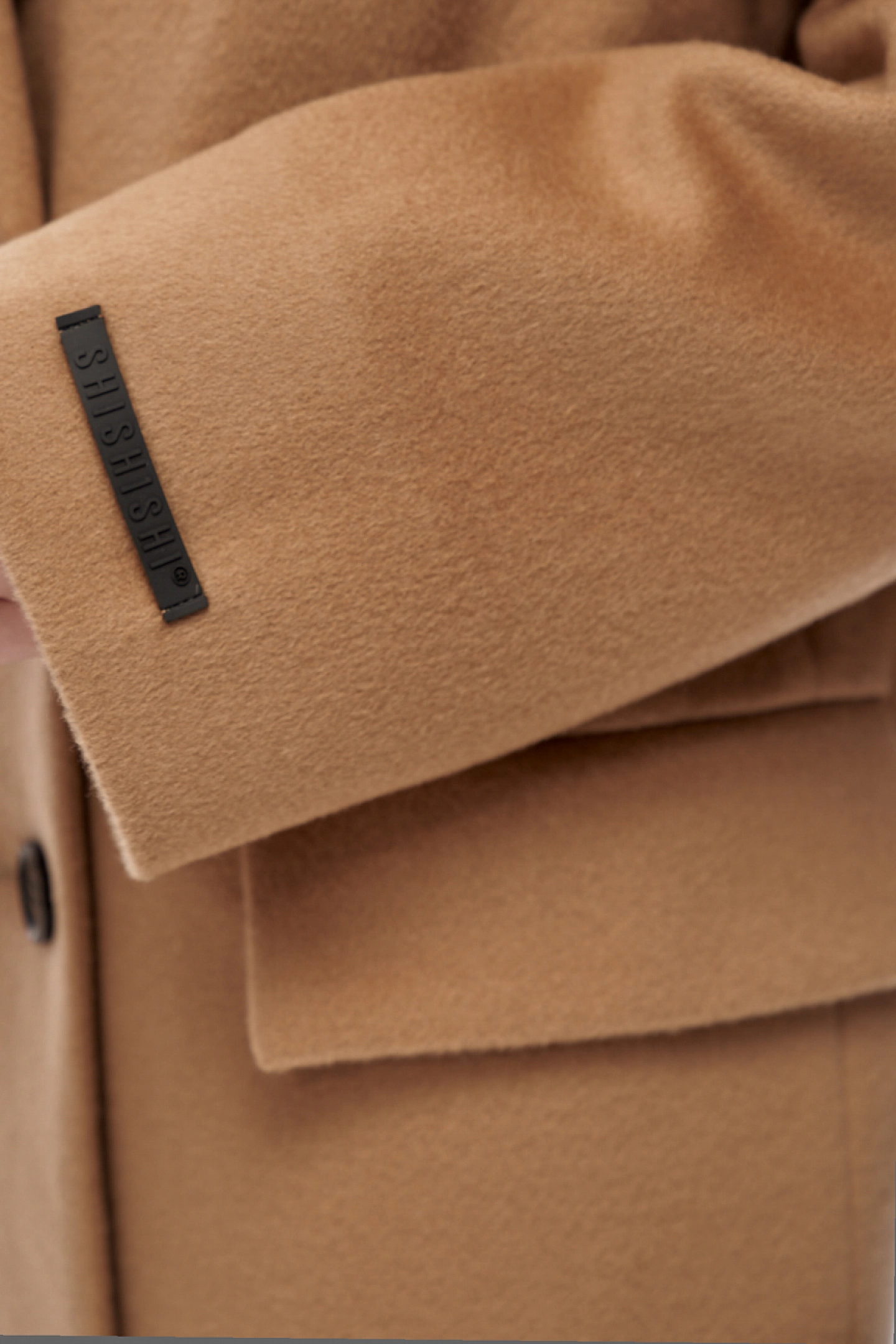 Double-breasted coat with contrasting buttons